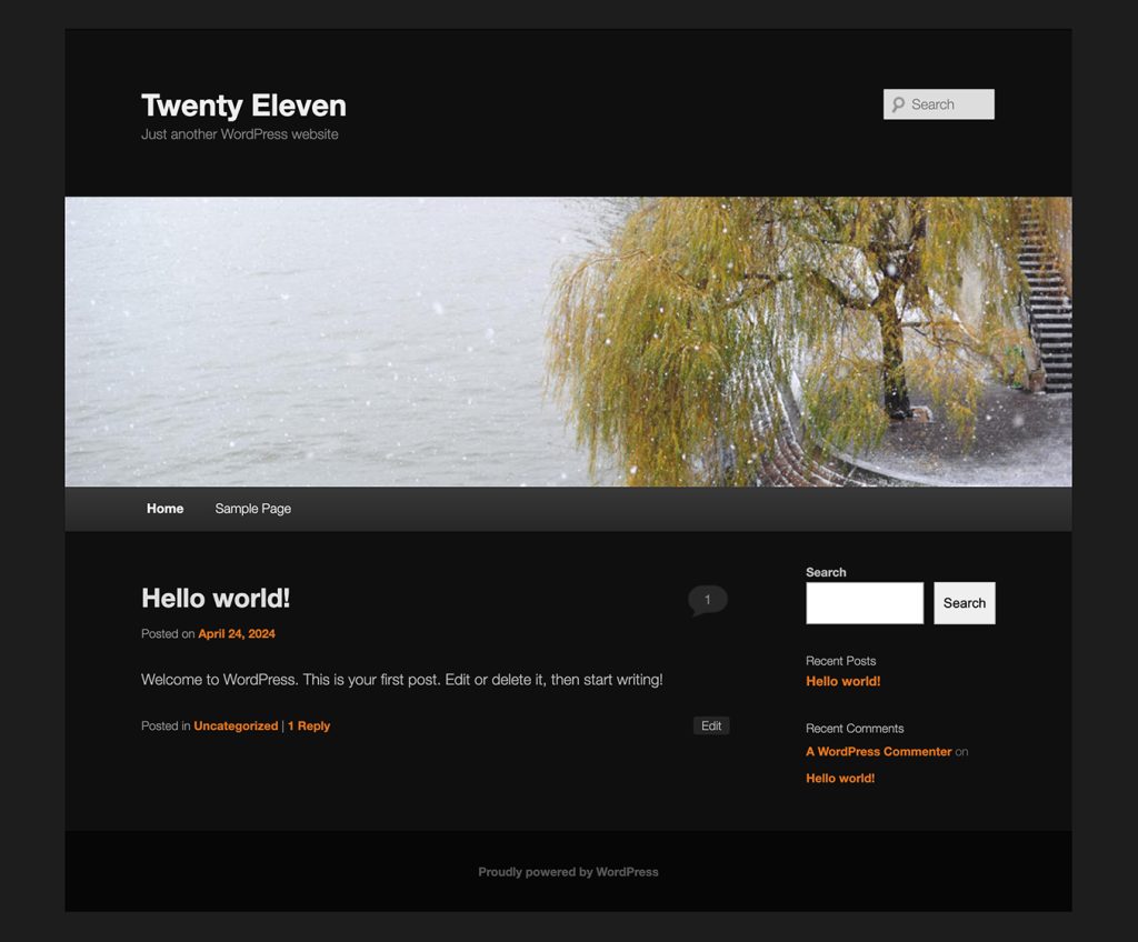 Screenshot of Twenty Eleven with the dark color scheme. The background is black with white and grey text with an orange accent color for the links.